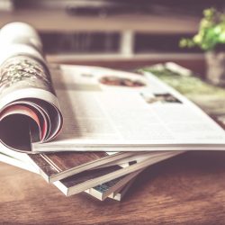 selective focus of stacking magazine place on table in living r PRENSA